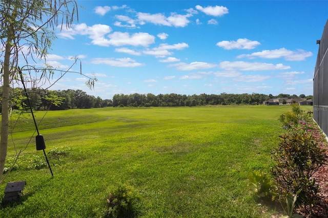 637 Neptune Dr, Groveland, FL 34736 - view of green lawn with golf course view and view of wooded area
