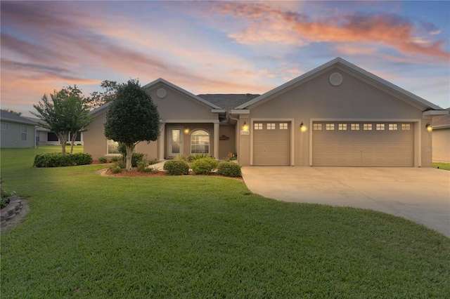 17355 SE 110th Ter, Summerfield, FL 34491 - ranch-style home with driveway, stucco siding, an attached garage, and a lawn