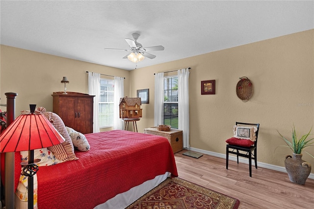17355 SE 110th Ter, Summerfield, FL 34491 - bedroom with wood finished floors and ceiling fan