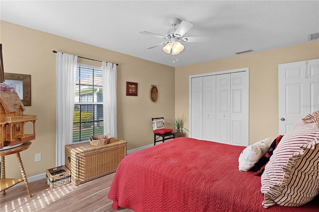 17355 SE 110th Ter, Summerfield, FL 34491 - bedroom featuring wood finished floors, a closet, and ceiling fan