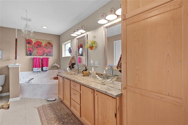17355 SE 110th Ter, Summerfield, FL 34491 - bathroom featuring a bath, vanity, and tile patterned flooring