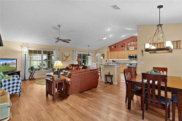 17355 SE 110th Ter, Summerfield, FL 34491 - living area with lofted ceiling, a ceiling fan, light wood-type flooring, and recessed lighting