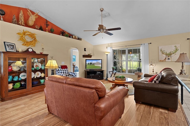 17355 SE 110th Ter, Summerfield, FL 34491 - living room with light wood finished floors, arched walkways, ceiling fan, and high vaulted ceiling