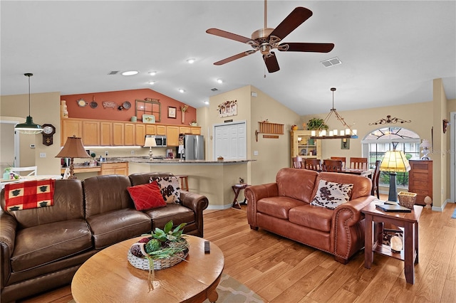 17355 SE 110th Ter, Summerfield, FL 34491 - living area with lofted ceiling, a ceiling fan, light wood finished floors, and recessed lighting