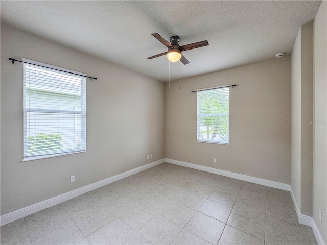 3021 King Palm Dr, New Smyrna Beach, FL 32168 - empty room with ceiling fan, a smoke detector, and a textured ceiling