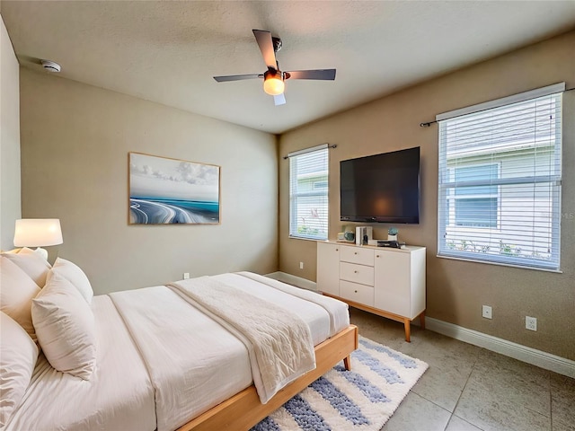 3021 King Palm Dr, New Smyrna Beach, FL 32168 - bedroom with baseboards and ceiling fan