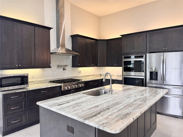 3021 King Palm Dr, New Smyrna Beach, FL 32168 - kitchen with appliances with stainless steel finishes, wall chimney range hood, light tile patterned flooring, light stone counters, and backsplash