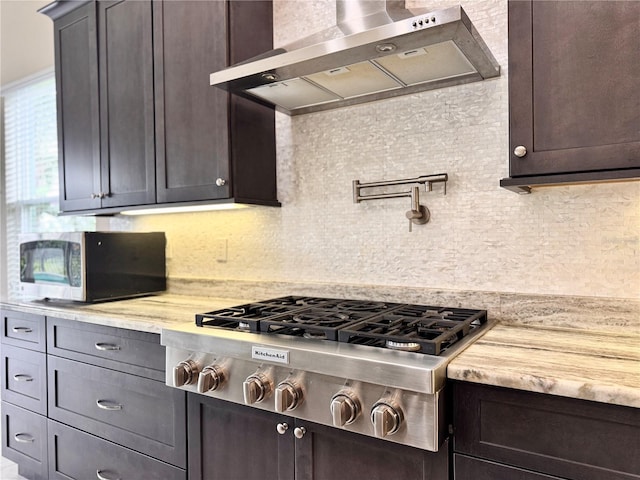 3021 King Palm Dr, New Smyrna Beach, FL 32168 - kitchen with wall chimney exhaust hood, appliances with stainless steel finishes, and decorative backsplash