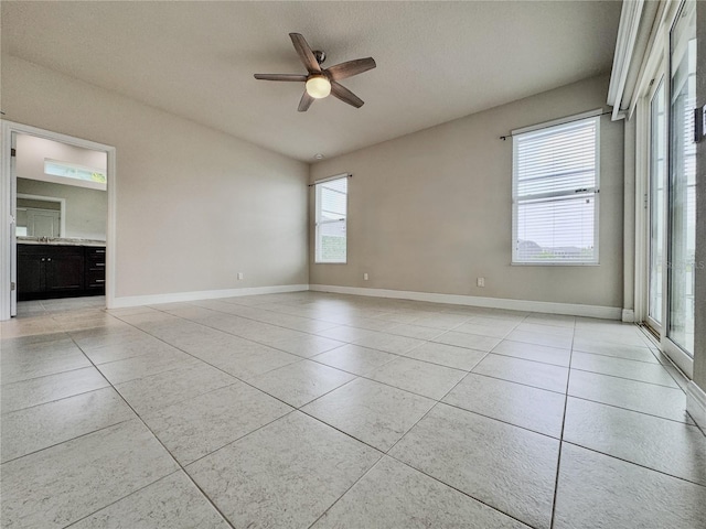 3021 King Palm Dr, New Smyrna Beach, FL 32168 - empty room with light tile patterned floors and a ceiling fan