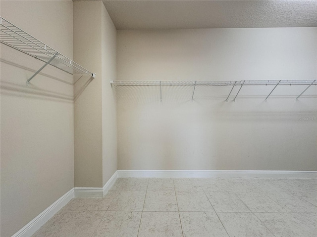 3021 King Palm Dr, New Smyrna Beach, FL 32168 - spacious closet with tile patterned flooring