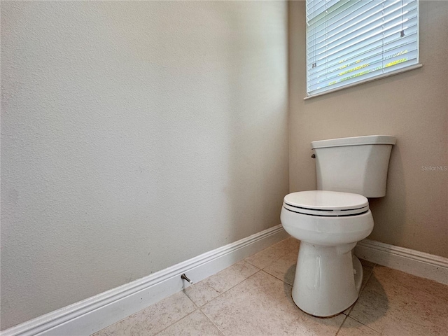 3021 King Palm Dr, New Smyrna Beach, FL 32168 - bathroom featuring toilet and tile patterned flooring