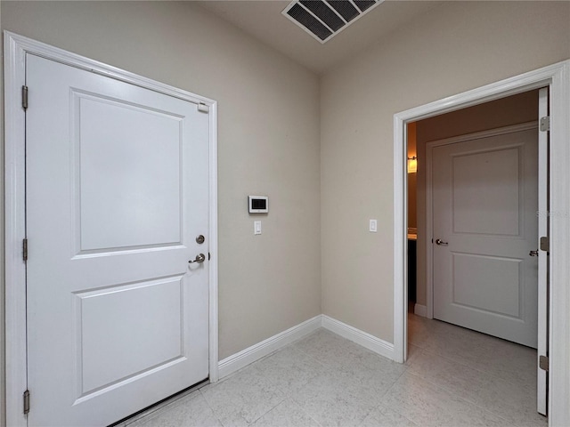 3021 King Palm Dr, New Smyrna Beach, FL 32168 - doorway to outside featuring baseboards and light tile patterned floors
