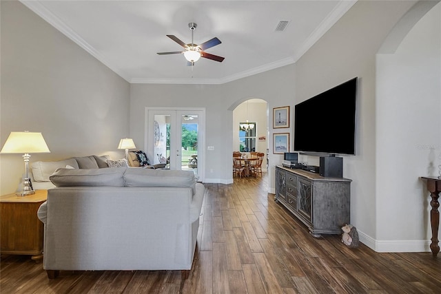 6008 Apex Way, Lady Lake, FL 32159 - living room featuring arched walkways, dark wood finished floors, ceiling fan, ornamental molding, and baseboards
