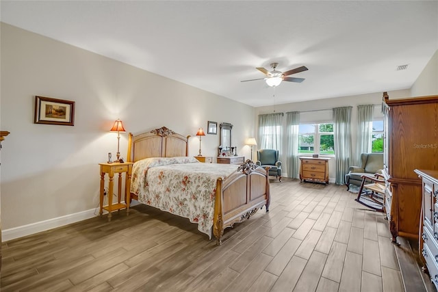 6008 Apex Way, Lady Lake, FL 32159 - bedroom featuring wood finished floors, baseboards, and ceiling fan