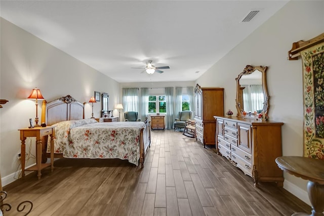 6008 Apex Way, Lady Lake, FL 32159 - bedroom featuring dark wood finished floors, a ceiling fan, and baseboards