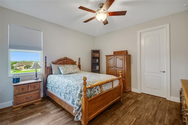 6008 Apex Way, Lady Lake, FL 32159 - bedroom featuring dark wood-type flooring, baseboards, and a ceiling fan