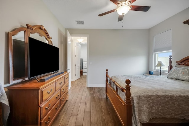 6008 Apex Way, Lady Lake, FL 32159 - bedroom with wood finished floors, baseboards, and ceiling fan