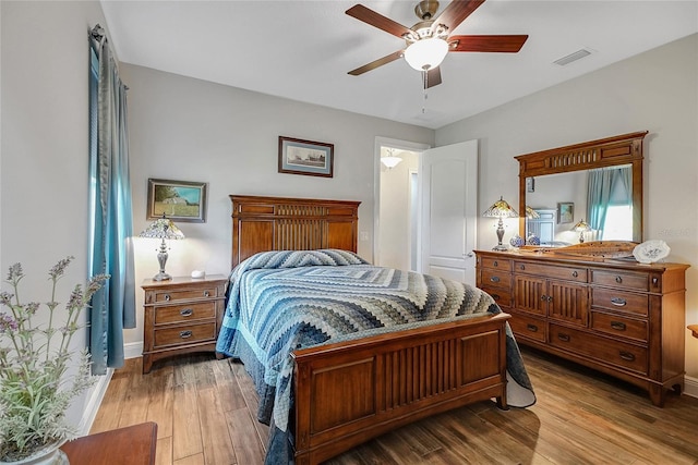 6008 Apex Way, Lady Lake, FL 32159 - bedroom featuring light wood-style flooring, a ceiling fan, and baseboards