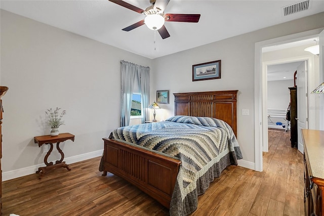 6008 Apex Way, Lady Lake, FL 32159 - bedroom with hardwood / wood-style floors, baseboards, and ceiling fan