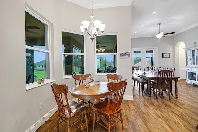 6008 Apex Way, Lady Lake, FL 32159 - dining room with wood finished floors, arched walkways, baseboards, ornamental molding, and ceiling fan