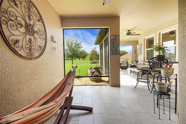 6008 Apex Way, Lady Lake, FL 32159 - doorway featuring a textured wall and ceiling fan
