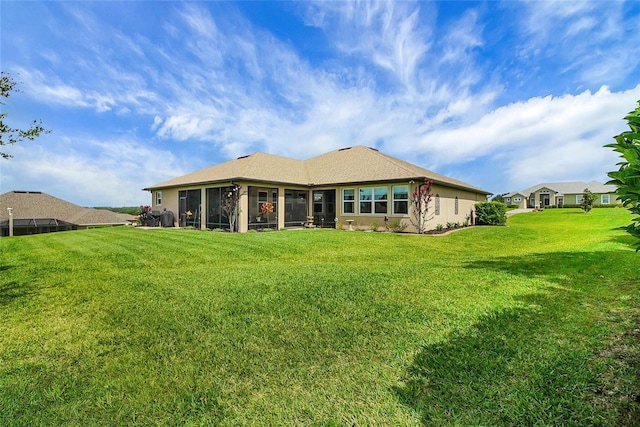 6008 Apex Way, Lady Lake, FL 32159 - rear view of house featuring a sunroom and a yard