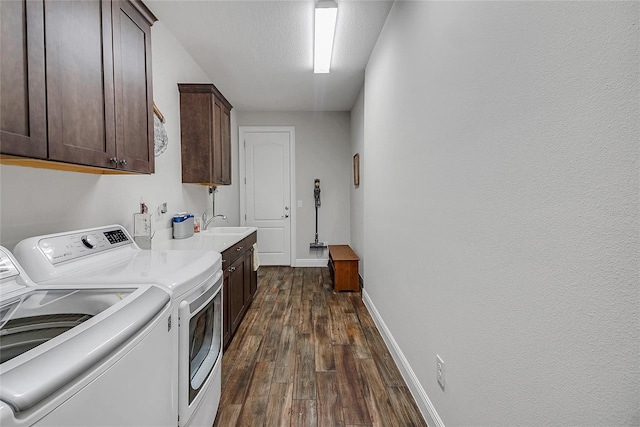 6008 Apex Way, Lady Lake, FL 32159 - laundry area with cabinet space, washer and dryer, dark wood finished floors, and baseboards