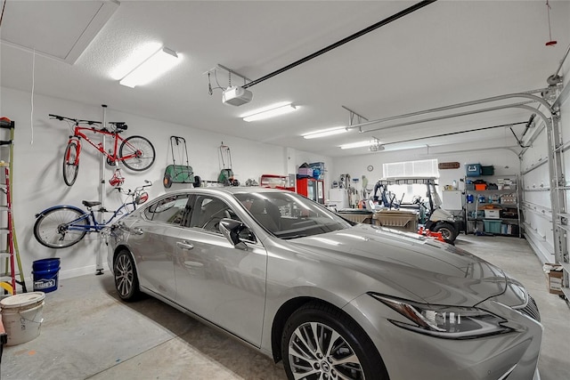 6008 Apex Way, Lady Lake, FL 32159 - garage with a garage door opener and baseboards