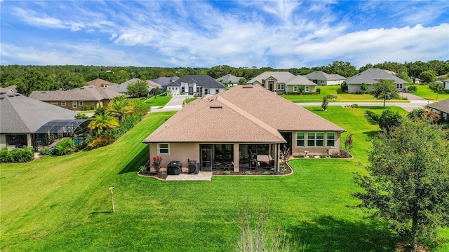 6008 Apex Way, Lady Lake, FL 32159 - rear view of house featuring a residential view, a lawn, a patio area, and a sunroom