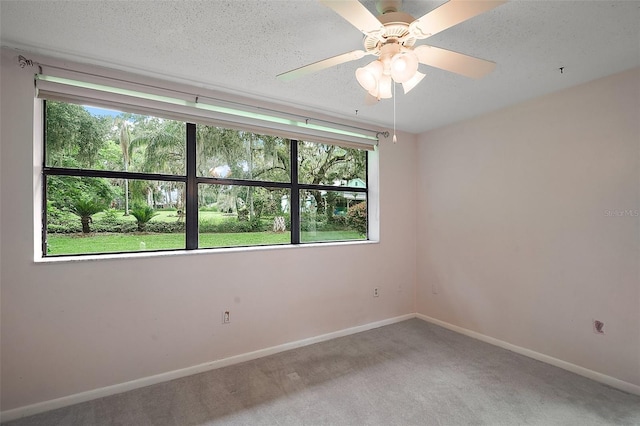27113 Robertson Rd, Yalaha, FL 34797 - carpeted empty room with baseboards, a textured ceiling, and a ceiling fan