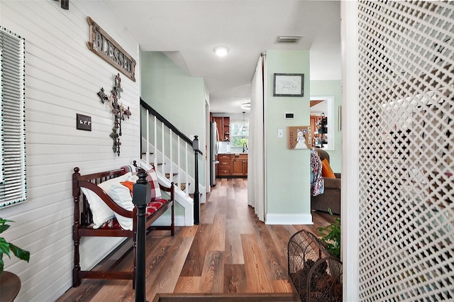 27212 Orange Ave, Yalaha, FL 34797 - hallway with stairway and wood finished floors