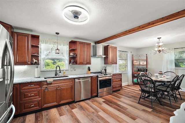 27212 Orange Ave, Yalaha, FL 34797 - kitchen featuring stainless steel appliances, open shelves, wall chimney range hood, light wood-style floors, and plenty of natural light