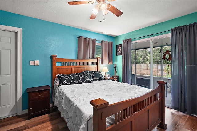 27212 Orange Ave, Yalaha, FL 34797 - bedroom with wood finished floors, a textured wall, a textured ceiling, and a ceiling fan