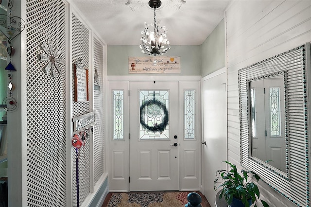 27212 Orange Ave, Yalaha, FL 34797 - entrance foyer featuring a chandelier