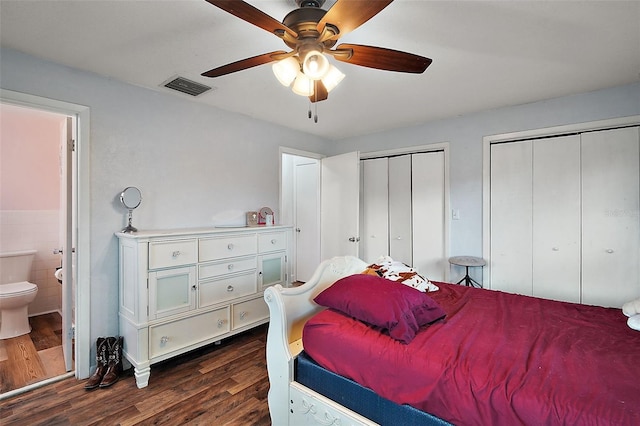 27212 Orange Ave, Yalaha, FL 34797 - bedroom featuring multiple closets, dark wood-type flooring, ensuite bath, and ceiling fan