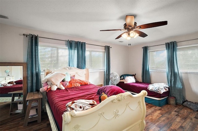 27212 Orange Ave, Yalaha, FL 34797 - bedroom with multiple windows, wood finished floors, and a ceiling fan