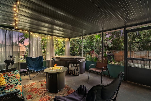 27212 Orange Ave, Yalaha, FL 34797 - sunroom with a hot tub and an outdoor fire pit