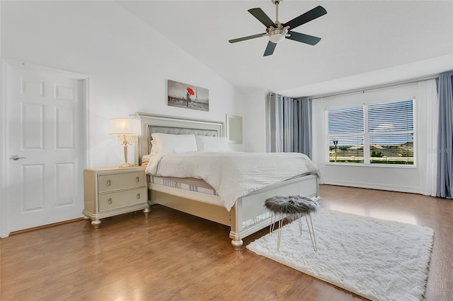 17300 Summer Sun Ct, Clermont, FL 34711 - bedroom with vaulted ceiling, wood finished floors, baseboards, and a ceiling fan