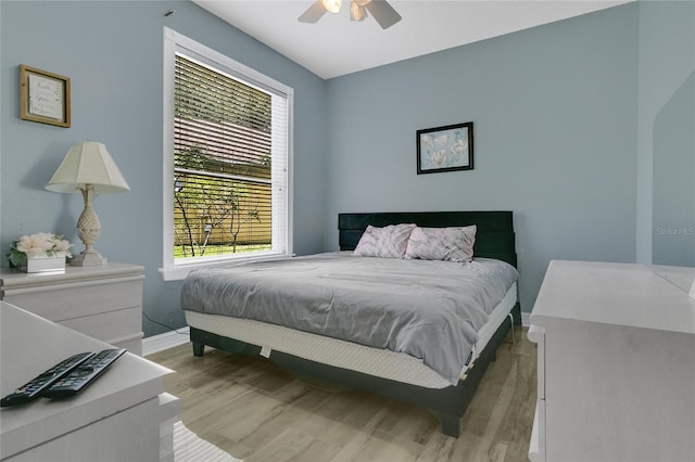 17300 Summer Sun Ct, Clermont, FL 34711 - bedroom with light wood-style flooring, baseboards, and ceiling fan