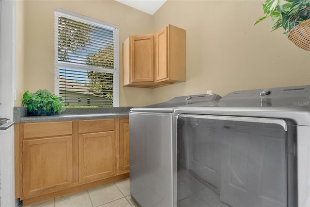 17300 Summer Sun Ct, Clermont, FL 34711 - laundry area featuring independent washer and dryer, cabinet space, and light tile patterned floors