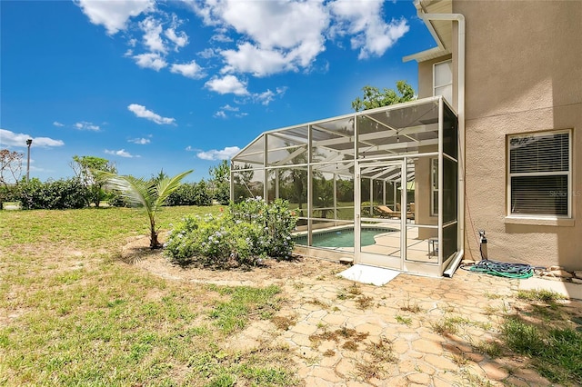 17300 Summer Sun Ct, Clermont, FL 34711 - view of grassy yard with a patio, an outdoor pool, and glass enclosure