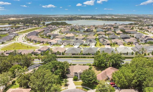 17300 Summer Sun Ct, Clermont, FL 34711 - aerial perspective of suburban area with a nearby body of water