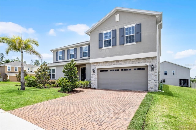 391 Cheeota Ct, Minneola, FL 34715 - view of front of home with decorative driveway, stucco siding, and an attached garage