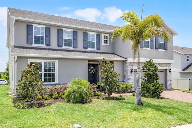 391 Cheeota Ct, Minneola, FL 34715 - view of front of house with stucco siding, an attached garage, and decorative driveway