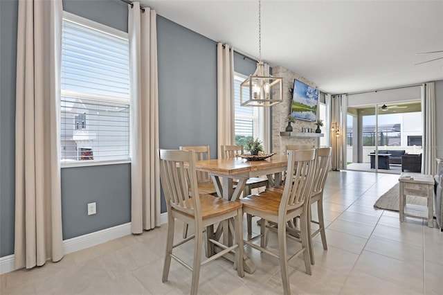 391 Cheeota Ct, Minneola, FL 34715 - dining area with baseboards and light tile patterned floors