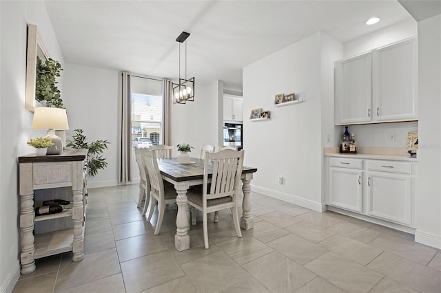 391 Cheeota Ct, Minneola, FL 34715 - dining area featuring a chandelier and light tile patterned flooring