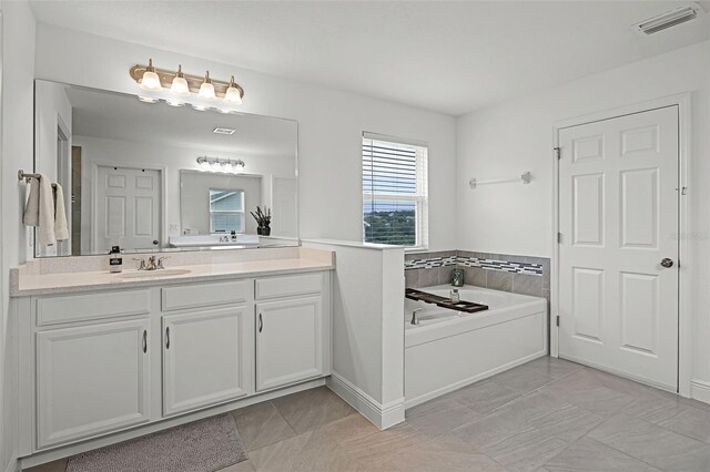 391 Cheeota Ct, Minneola, FL 34715 - bathroom with vanity and a garden tub