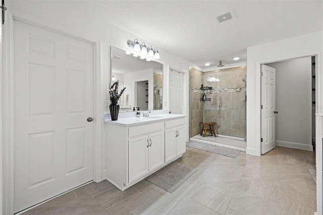 391 Cheeota Ct, Minneola, FL 34715 - bathroom featuring a shower stall, vanity, and recessed lighting