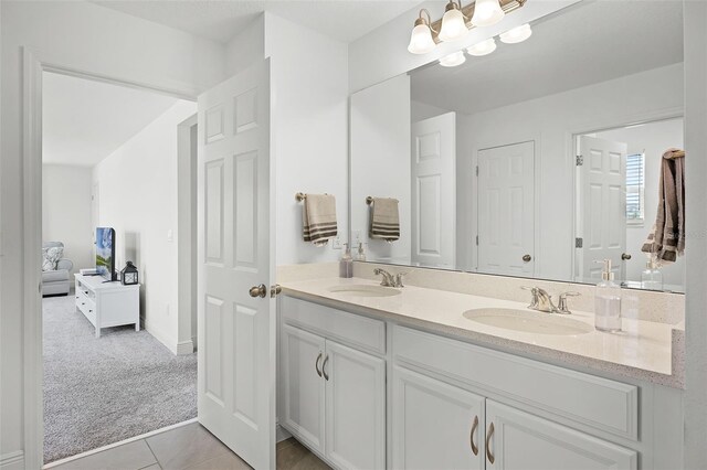391 Cheeota Ct, Minneola, FL 34715 - full bathroom with double vanity, tile patterned flooring, and a chandelier