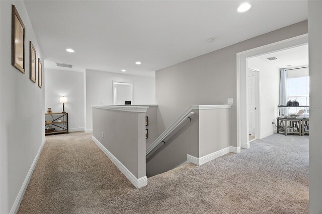 391 Cheeota Ct, Minneola, FL 34715 - hallway with an upstairs landing, carpet flooring, and recessed lighting